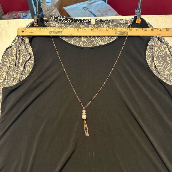 Elegant Black and White Blouse with Layered Design - Picture 2 of 11